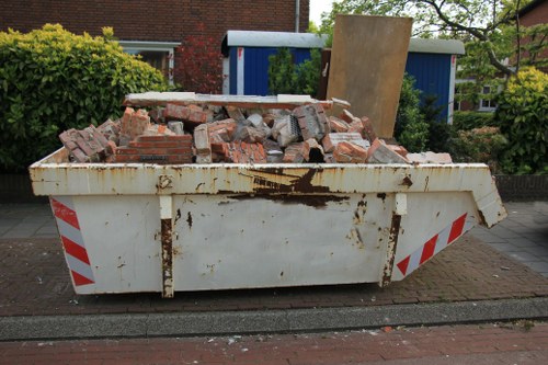 Skip lorry and skip on street at project start