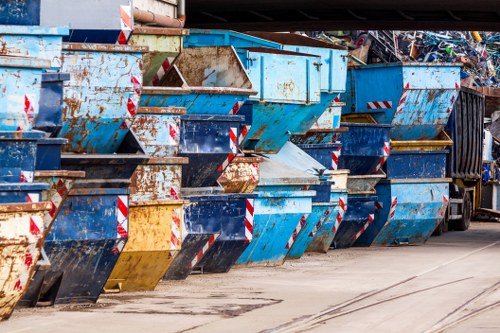 Barbican street with a placed skip container