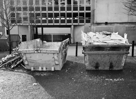 Enclosed and lockable skip placed on residential property in Barbican