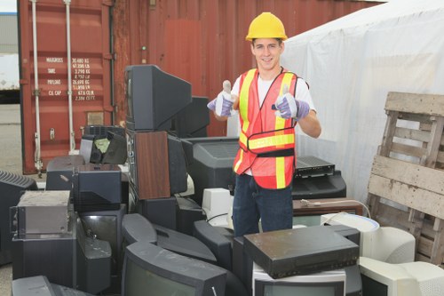 Friendly staff assisting customers with skip hire in Barbican