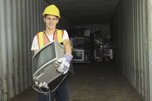 Barbican residents loading waste into a skip container