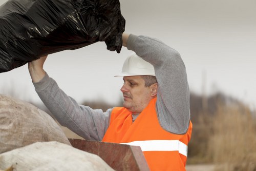 Low-emission truck unloading sorted materials at a local transfer station